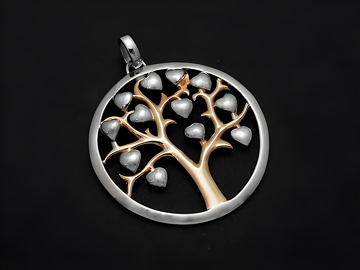 Silberanhänger in Rhodinierung mit einem bicolor Lebensbaum, der filigran gestaltet ist. Der Anhänger symbolisiert Glück und wird vom Juwelier Harnisch hergestellt.
