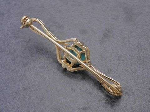 Gold auf Silber Brosche mit filigranem Design und türkisem Stein, Hersteller: Juwelier Harnisch, elegant und vornehm, ideal für besondere Anlässe.