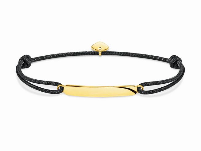 Thomas Sabo Armband aus Sterling Silber veredelt mit vergoldetem Element, kombiniert mit schwarzem Nylon. Anpassbare Länge von 16 bis 27 cm für einen individuellen Sitz.