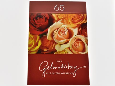 Eine Geburtstagskarte mit bunten Rosenblüten in warmen Farben und der Aufschrift zum Geburtstag alle guten Wünsche in eleganter Schrift, Hersteller Juwelier Harnisch.