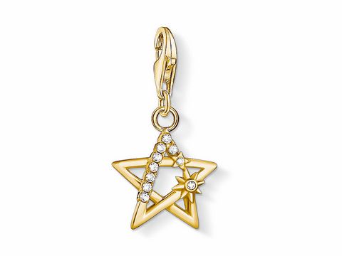 Ein goldfarbener Thomas Sabo Charm in Form eines Sterns mit Zirkonia-Steinen und zusätzlichem Sonnen- und Mondmotiv, ideal für perfekten Schmuckliebhaber.
