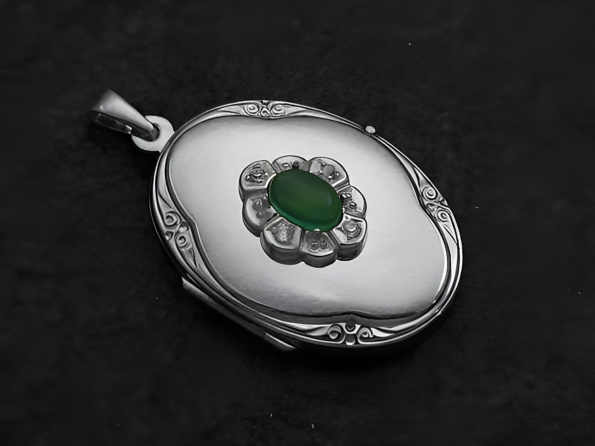 Achat grün Medaillon Cabochon in Weißgold 585, verziert mit einer floralen Anordnung aus kleinen Steinen, elegantes und zeitloses Design des Juwelier Harnisch.