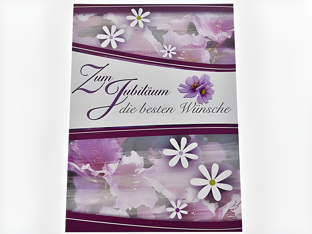 Glückwunschkarte mit verschiedenen Blüten in lila und weißen Farben, dekoriert mit dem Text Zum Jubiläum die besten Wünsche, hergestellt von Juwelier Harnisch.