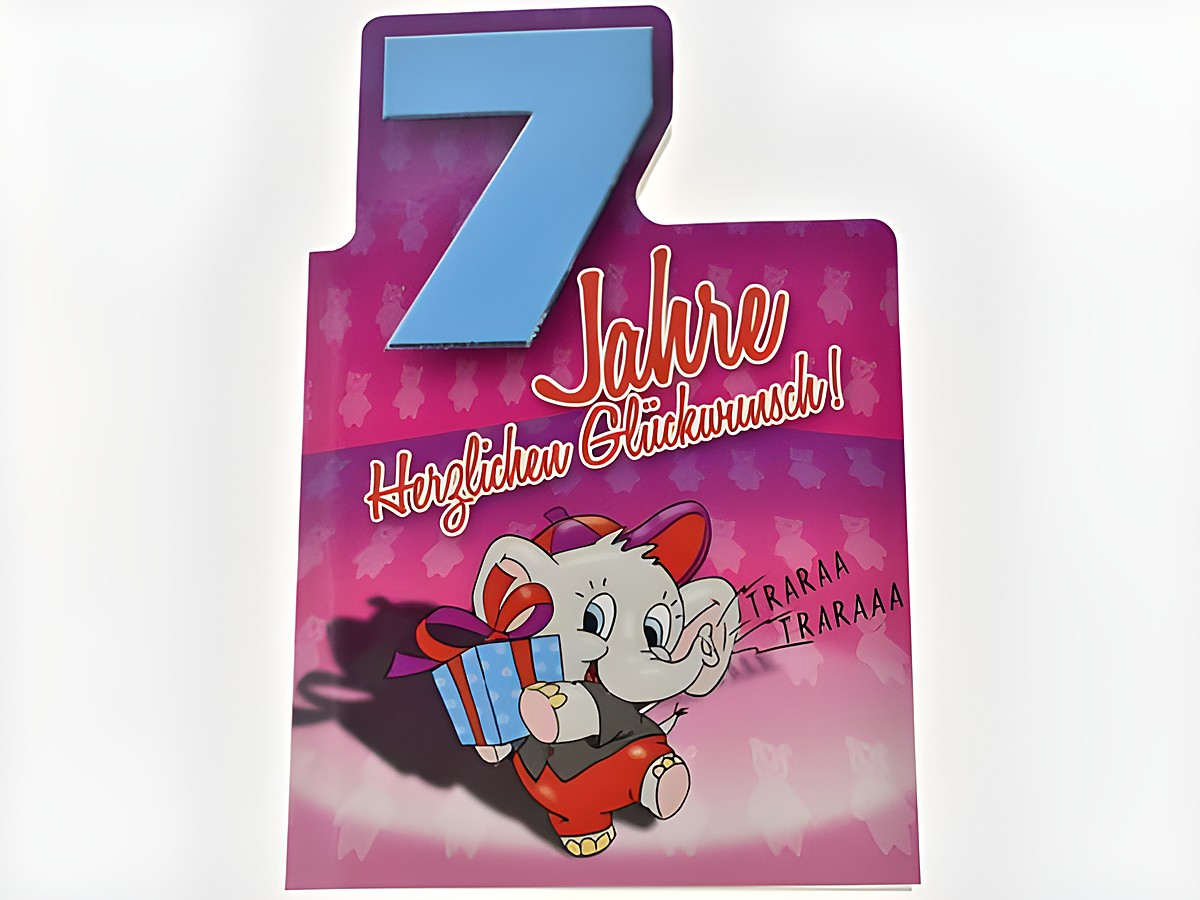 Geburtstagskarte mit einem niedlichen Elefanten, der ein Geschenk hält. Die Karte hat die Aufschrift „7 Jahre Herzlichen Glückwunsch“ und eine farbenfrohe Gestaltung. Hersteller: Juwelier Harnisch.