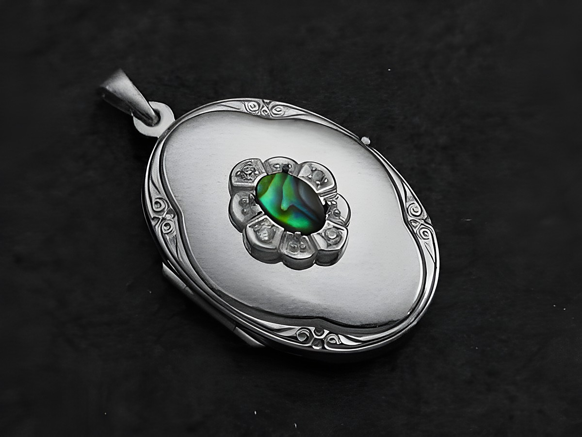 Medaillon aus Sterling Silber mit Paua Shell Cabochon in der Mitte, umrahmt von Zirkonia, Hersteller Juwelier Harnisch, stilvolles Schmuckstück für besondere Anlässe.