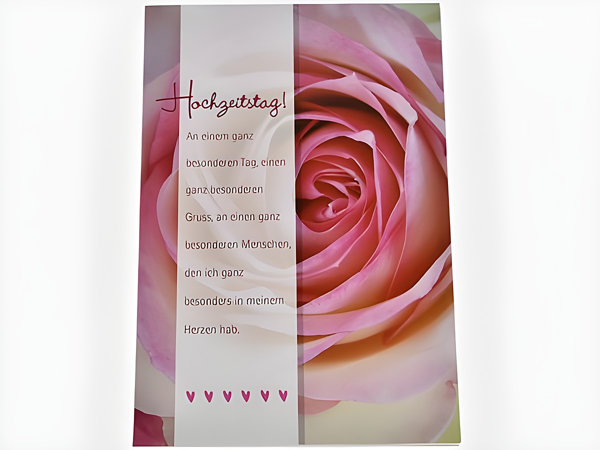 Hochzeitskarte mit einer rosefarbigen Rose im Hintergrund und dem Text Hochzeittag An einem ganz besonderen Tag in elegantem Design, Hersteller Juwelier Harnisch, Hochzeitskarten.