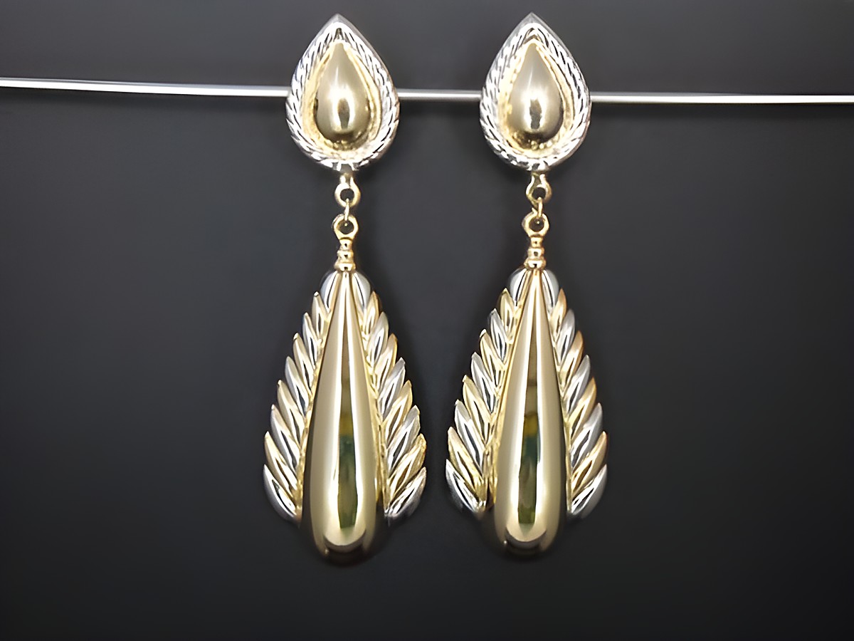 Ohrclip - 82,8 mm - zeitlos - gold- und silberfarben, Hersteller: Juwelier Harnisch, mit einem eleganten Design aus geschwungenen Formen und feinen Details.