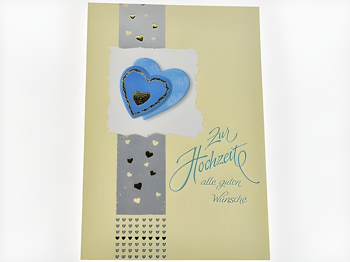 Hochzeitskarte in Gelb mit blauen Herzen und goldenen Akzenten, beschriftet mit 'Zur Hochzeit alle guten Wünsche', hergestellt von Juwelier Harnisch.