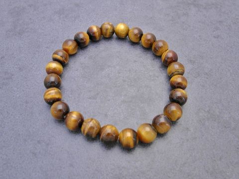 Tigerauge Armband in goldbraun, 20 cm mit Gummizug, Hersteller Juwelier Harnisch, Armband mit Edelsteinen. Elegant und zeitlos im Design. Perfekt für jeden Anlass.