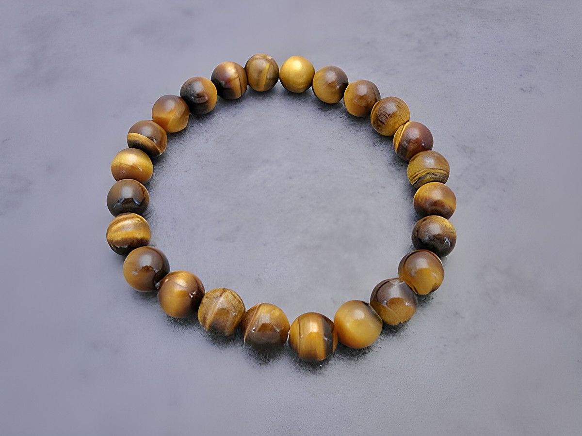Tigerauge Armband in goldbraun, 20 cm mit Gummizug, Hersteller Juwelier Harnisch, Armband mit Edelsteinen. Elegant und zeitlos im Design. Perfekt für jeden Anlass.