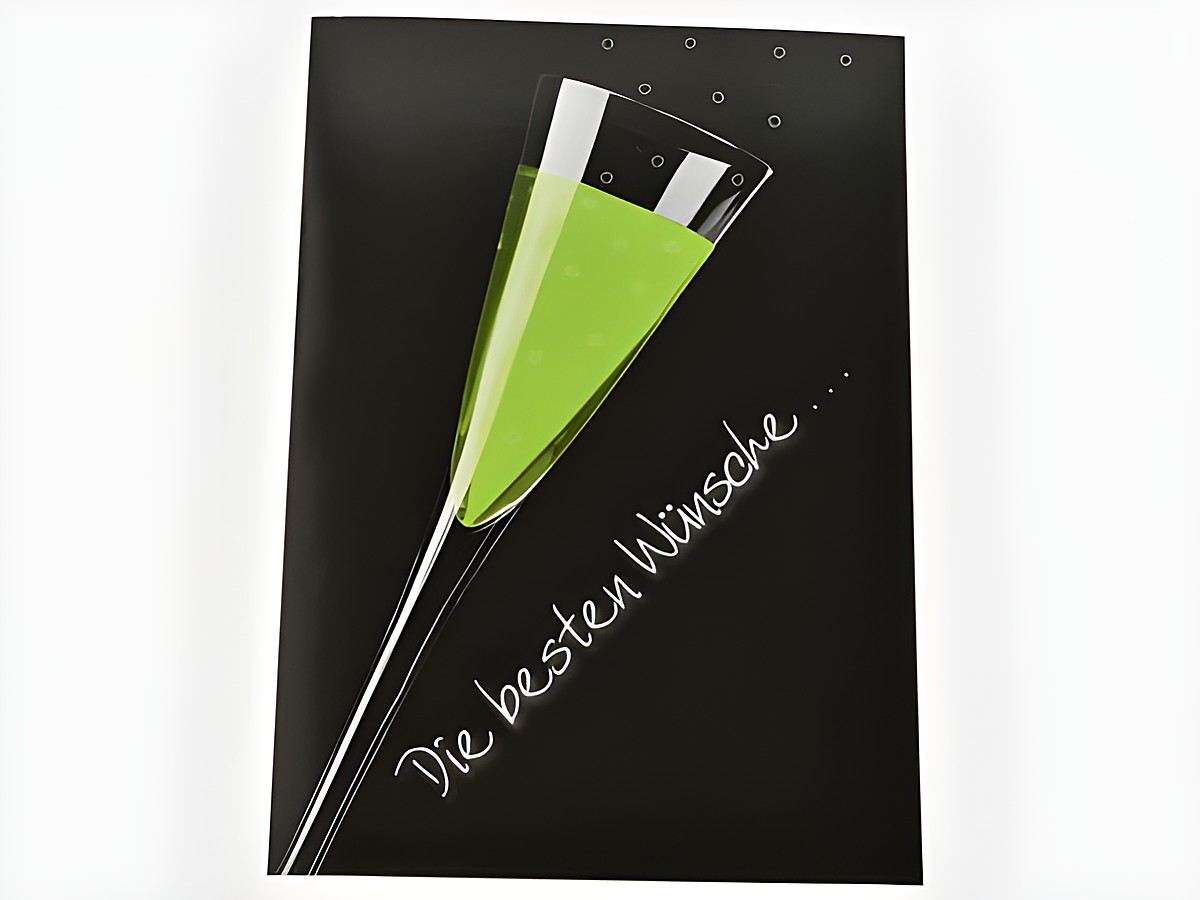 Geburtstagskarte mit einem Sektglas, das mit grünem Inhalt gefüllt ist. Im Hintergrund schwarze Farbe und der Schriftzug Die besten Wünsche. Hersteller ist Juwelier Harnisch.