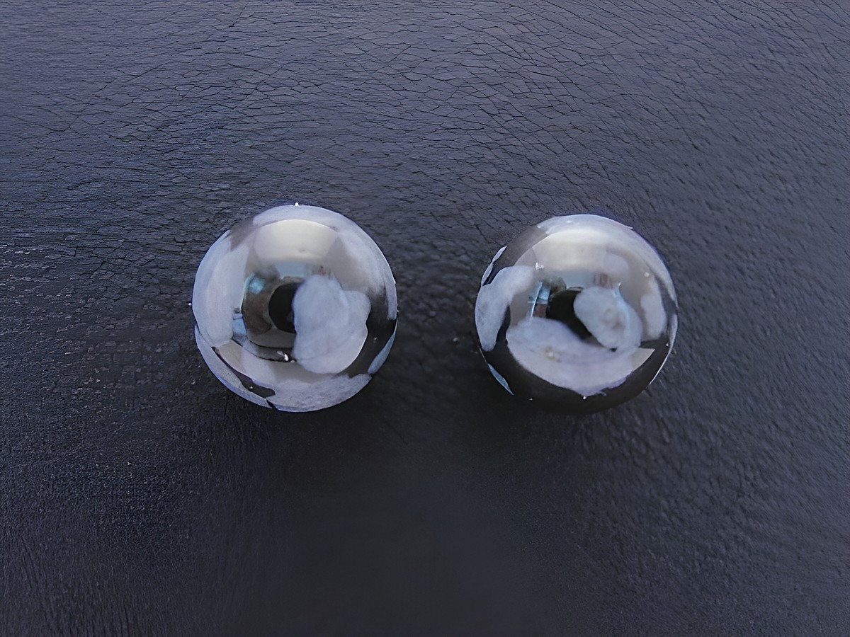 Ohrringe Kugel aus Sterling Silber mit Achat in schwarz und grau, Hersteller Juwelier Harnisch, elegante Schmuckstücke für besondere Anlässe.