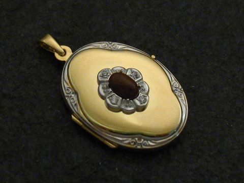 Mahagoni Obsidian Medaillon Cabochon in Gold 333 bicolor mit Brillanten, Hersteller Juwelier Harnisch, elegant und zeitlos, ein Schmuckstück für besondere Anlässe.