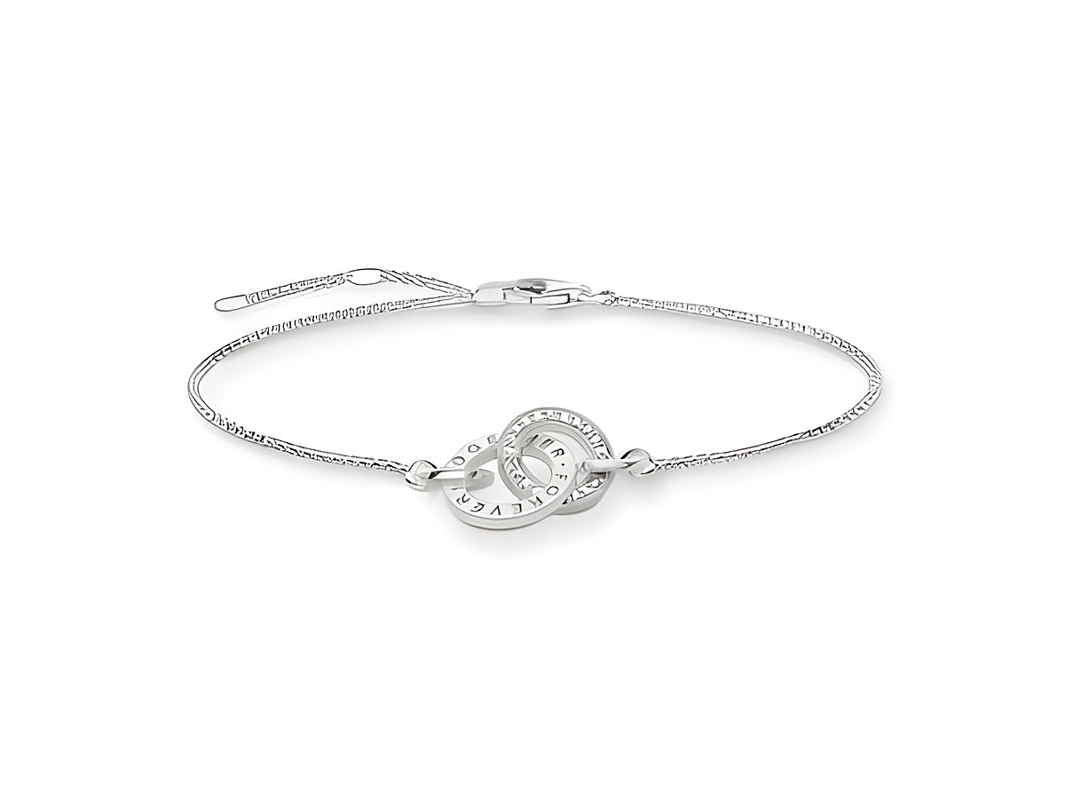Elegantes Thomas Sabo Armband aus 925 Sterling Silber, längenverstellbar 16,5/18/19,5 cm, mit Zirkonia in Weiß und verzierter Ringschließe. Perfekt für stilvolle Anlässe.