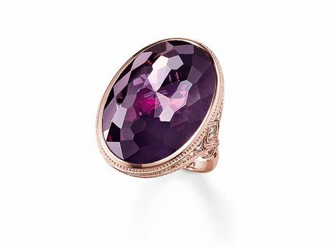 Silberner Ring von Thomas Sabo, vergoldet mit Roségold, verziert mit Zirkonia, ovale lila Steinfassung, Größe 54.
