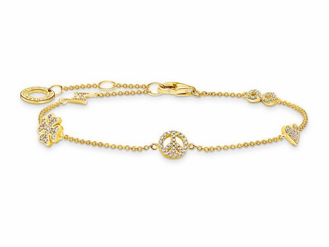 Ein elegantes Thomas Sabo Armband aus vergoldetem Sterling Silber mit Zirkonia in Weiß, verziert mit liebevollen Anhängern wie Herz und Friedenzeichen, ein stilvolles Accessoire von 16 bis 19 cm.