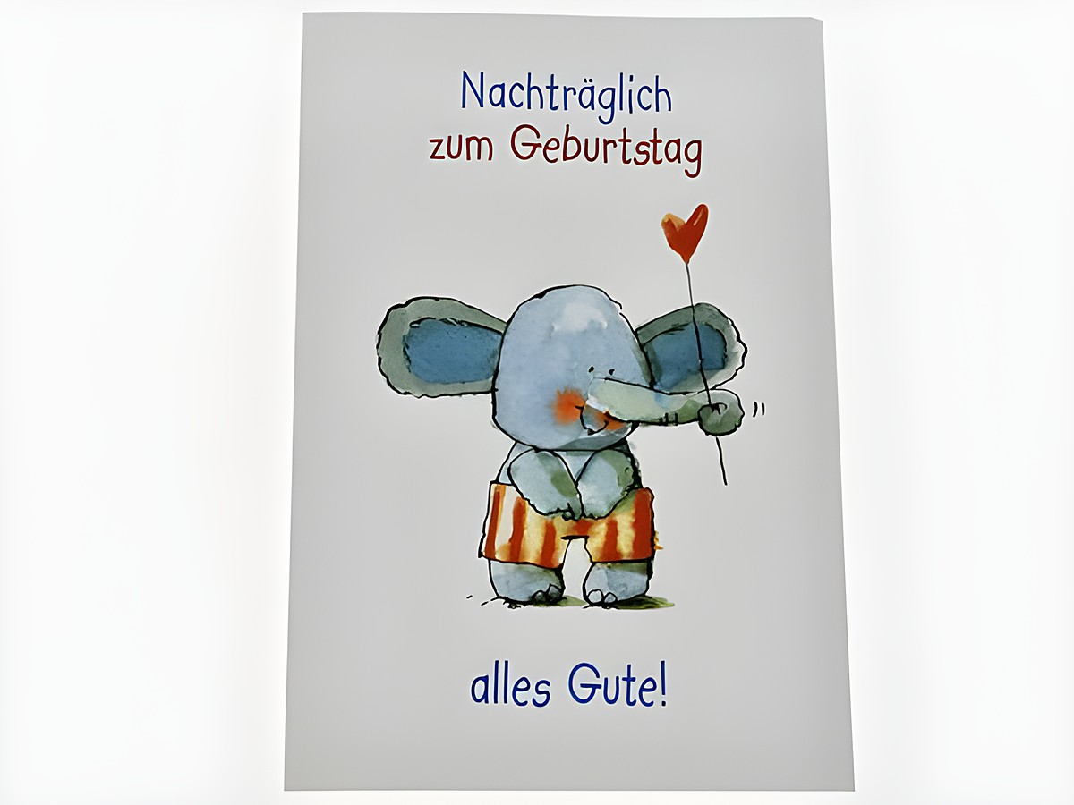 Kleine Geburtstagskarte mit einem niedlichen Elefanten, der einen roten Herzballon hält. Der Text lautet nachträglich zum Geburtstag alles Gute. Hersteller Juwelier Harnisch.