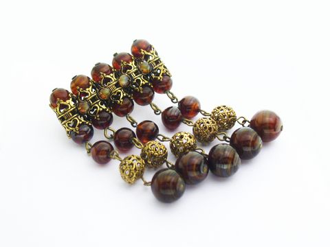 60044-0 Braune Damen Brosche im Sexy City Look aus Modeschmuck mit verschiedenen goldfarbenen und braunen Perlen, entworfen von Juwelier Harnisch. Perfekt als modisches Accessoire.